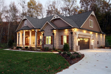 Inspiration for a mid-sized timeless brown two-story brick exterior home remodel in Other