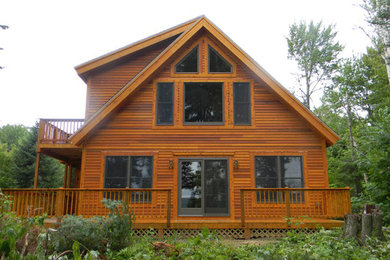 Large brown two-story wood gable roof idea in Portland Maine