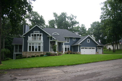 Traditional blue two-story concrete fiberboard exterior home idea in Grand Rapids