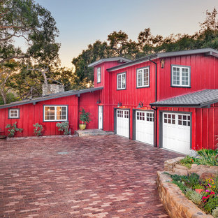 Cottage red two-story exterior home idea in Santa Barbara with a shingle roof