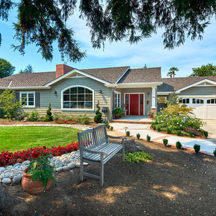 Large traditional green one-story wood gable roof idea in San Francisco