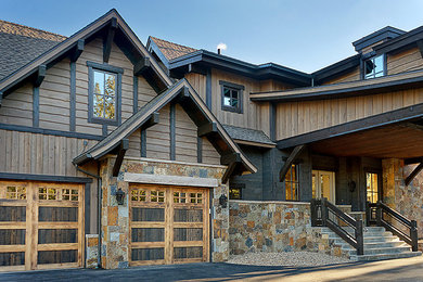 Rustic wood exterior home idea in Denver