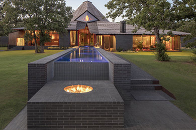 Inspiration for a black one-story brick house exterior remodel in Kansas City
