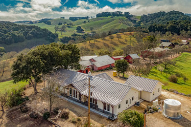 Inspiration for a farmhouse white one-story concrete fiberboard exterior home remodel in San Luis Obispo
