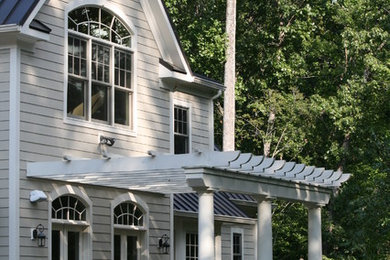 Example of a farmhouse exterior home design in DC Metro