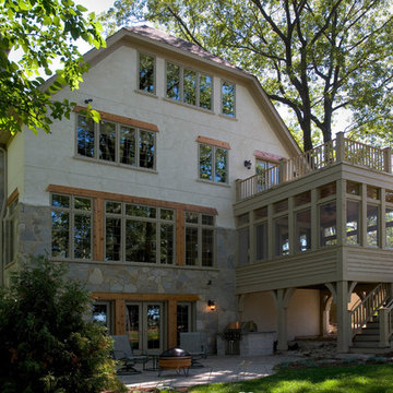 Rear Elevation of Stone and Stucco French Country Vacation Home Featuring Screen