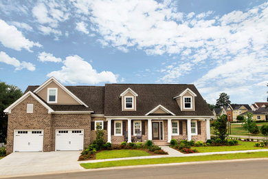 Example of a large cottage brown two-story brick gable roof design in Atlanta