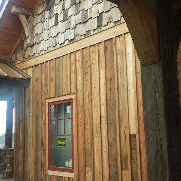 Recliaimed barnwood shake siding paired with board and batten