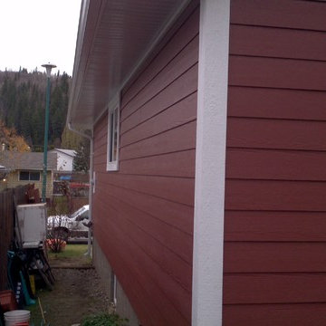 Red certainteed fiber cement siding and white smart trim