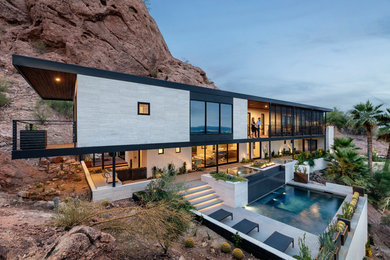 Inspiration for a modern two-story house exterior remodel in Phoenix