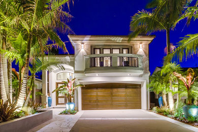 Example of a mid-sized tuscan white two-story stucco exterior home design in San Diego