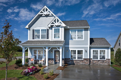 Inspiration for a large timeless gray two-story mixed siding exterior home remodel in Charlotte