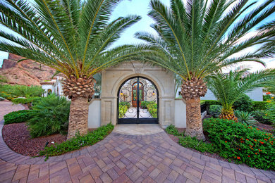 Design ideas for an expansive and white mediterranean bungalow render house exterior in Phoenix.