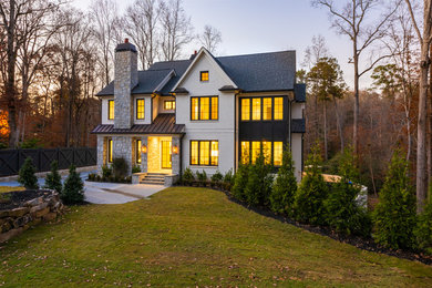 Example of a huge transitional multicolored two-story mixed siding exterior home design in Atlanta with a mixed material roof