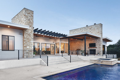 Example of a huge minimalist beige one-story mixed siding exterior home design with a mixed material roof