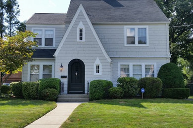 Mid-sized traditional gray two-story wood exterior home idea in Boston with a clipped gable roof