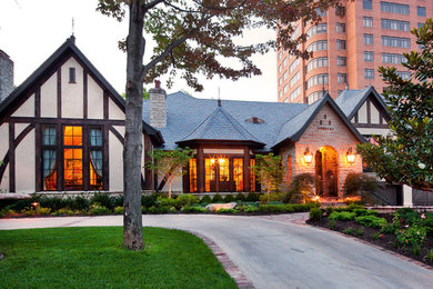 Mid-sized traditional two-story stucco exterior home idea in Kansas City