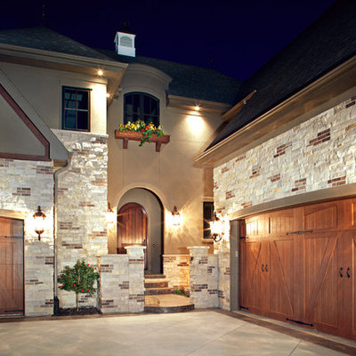 Traditional stone exterior home idea in Omaha