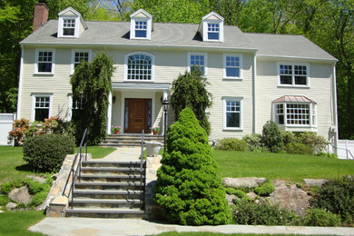 This is an example of a large and white traditional two floor detached house in New York with a hip roof and a shingle roof.