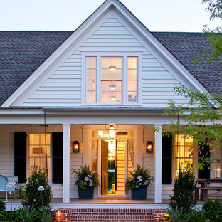 Cottage white two-story wood exterior home photo in Atlanta