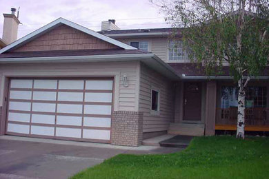 Inspiration for a timeless mixed siding exterior home remodel in Calgary