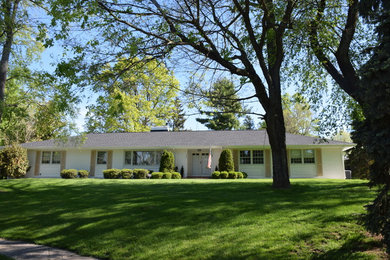 Example of a mid-sized classic white one-story wood house exterior design in Other with a hip roof and a shingle roof