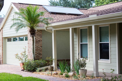Traditional green one-story mixed siding gable roof idea in Orlando