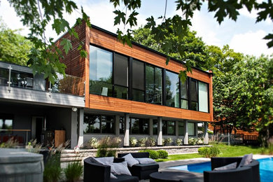 Inspiration for a contemporary house exterior remodel in Montreal