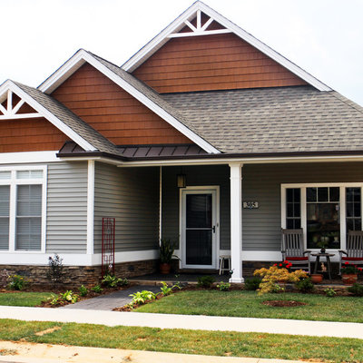Small traditional gray two-story vinyl exterior home idea in Other