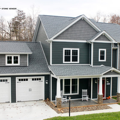 Inspiration for a mid-sized timeless gray two-story concrete fiberboard exterior home remodel in Other