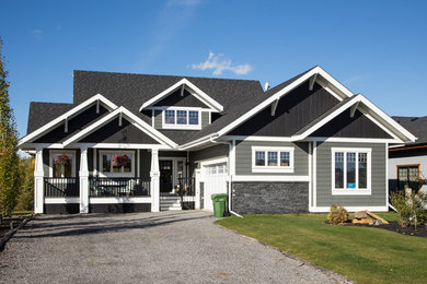 Large craftsman two-story concrete fiberboard exterior home idea in Other with a shingle roof