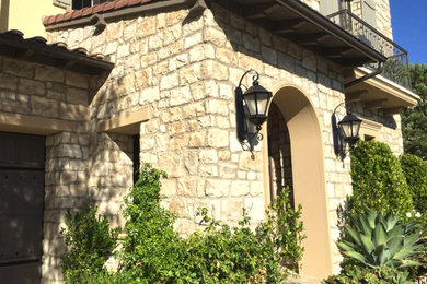 Example of a stone exterior home design in Tampa