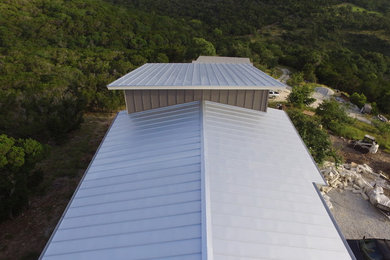 Example of a metal exterior home design in Austin