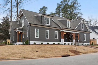 Large arts and crafts gray two-story mixed siding exterior home photo in Raleigh