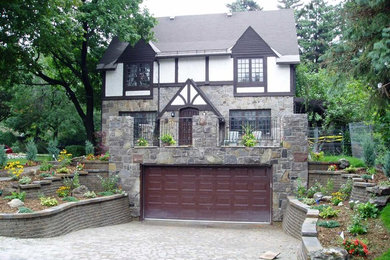 Inspiration for a large contemporary gray three-story stone exterior home remodel in Montreal