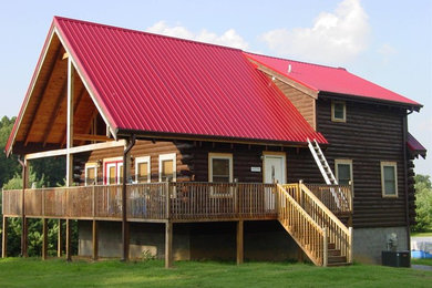 Photo of a brown two floor house exterior in Other with metal cladding.