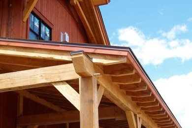Inspiration for a mid-sized craftsman red two-story wood gable roof remodel in San Diego