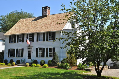Example of a classic white two-story wood exterior home design in New York
