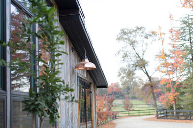 Example of a large cottage chic gray one-story wood exterior home design in Sacramento with a metal roof