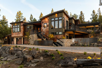 Mountain style brown two-story mixed siding exterior home photo in Portland