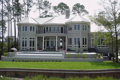 Example of a large trendy gray two-story mixed siding exterior home design in Atlanta with a hip roof