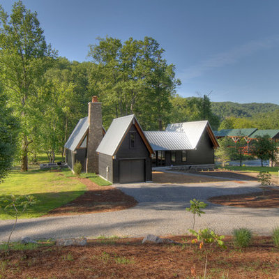 Inspiration for a mid-sized rustic two-story exterior home remodel in Other