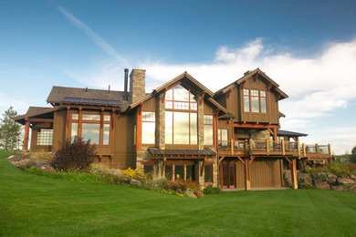 Example of a large mountain style brown two-story mixed siding exterior home design in Other with a shingle roof