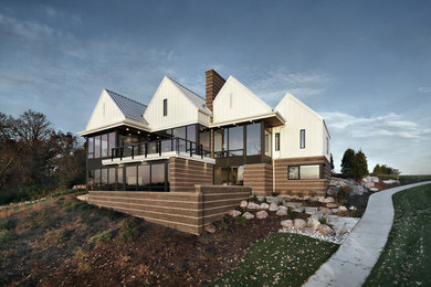 Example of a mid-sized transitional white two-story concrete fiberboard exterior home design in Other