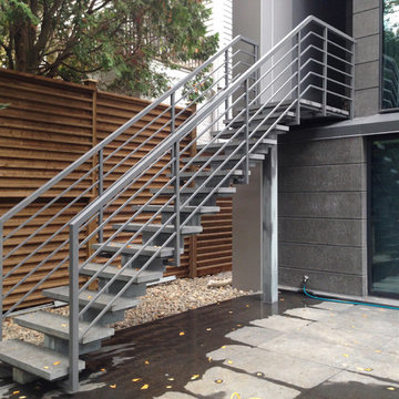 Riverview Drive privet house exterior metal and stone staircase