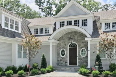 Inspiration for a timeless gray two-story wood house exterior remodel in Bridgeport with a gambrel roof and a shingle roof
