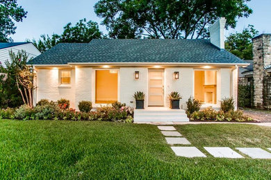 Mid-sized transitional yellow one-story brick gable roof idea in Dallas