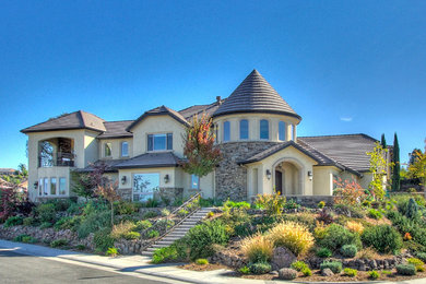 Huge elegant multicolored two-story mixed siding house exterior photo in Sacramento with a hip roof and a shingle roof
