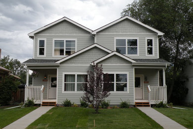 Large elegant gray two-story wood exterior home photo in Denver with a clipped gable roof