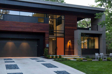 Mid-sized contemporary gray concrete house exterior idea in Kansas City